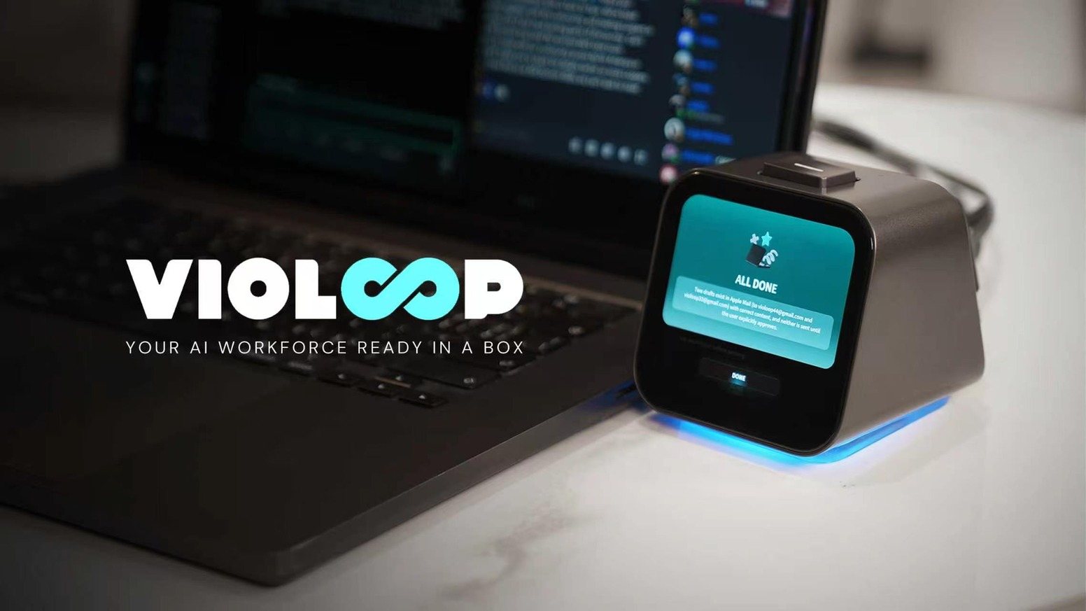 Violoop AI PC agent hardware beside a keyboard and monitor