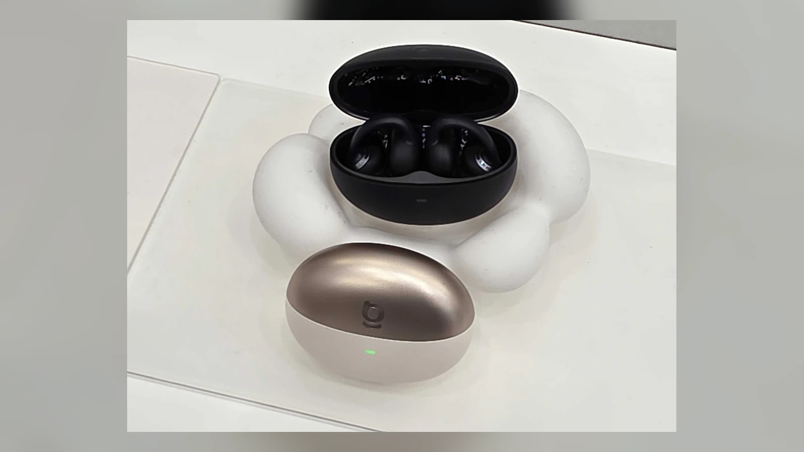 Baseus Bowie MC2 NC clip-on earbuds and charging cases displayed at IFA 2026