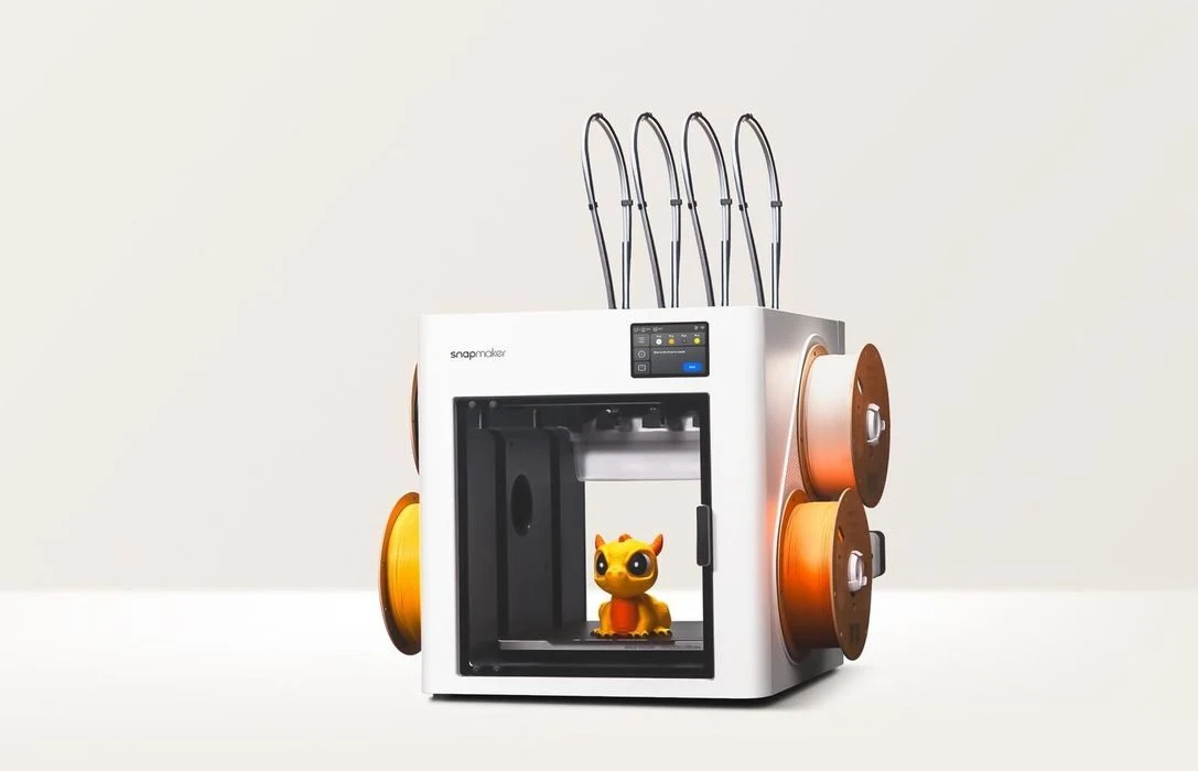 Snapmaker U1 multicolor toolchanging 3D printer with four filament feeds and a printed model inside
